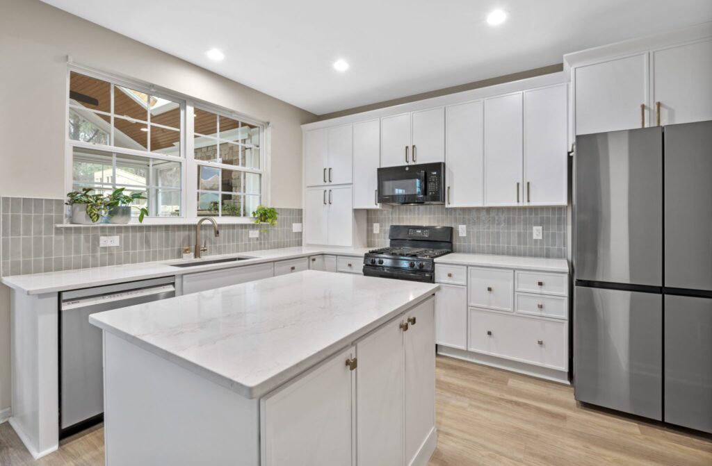 Updated kitchen cabinets, tile backsplash and storage solutions