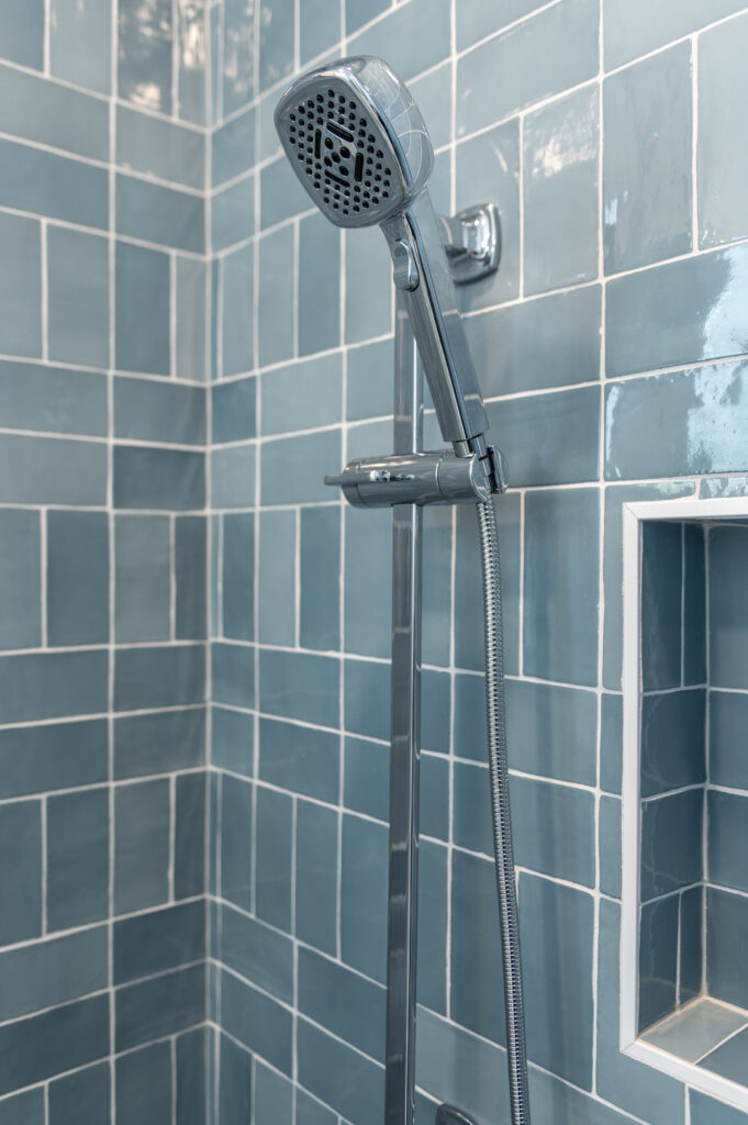 Custom shower detail with blue herringbone tile