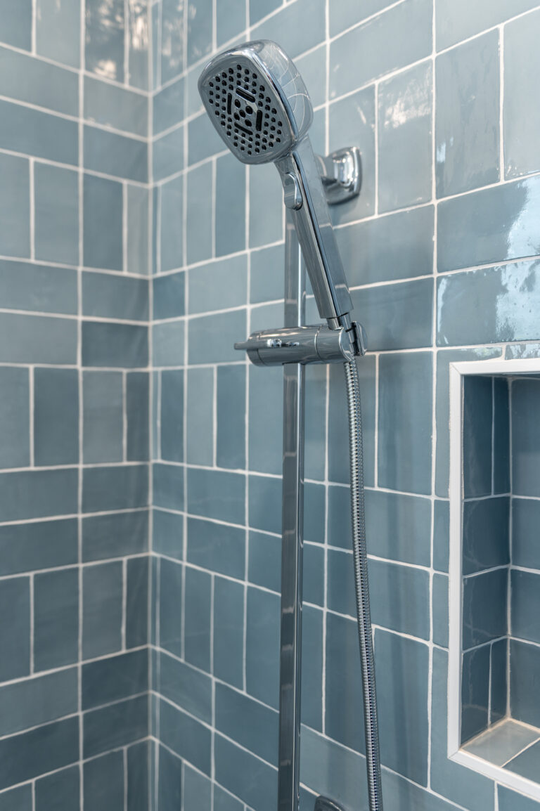Custom shower detail with blue herringbone tile