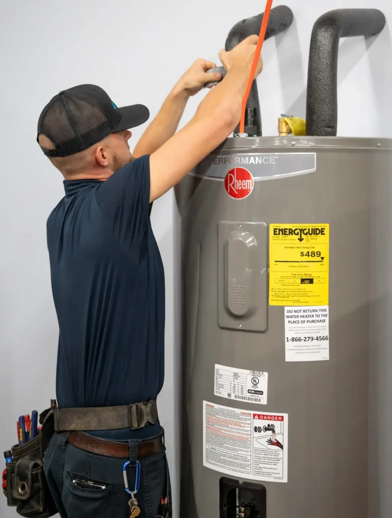 nc water heaters technician working on a tanked water heater