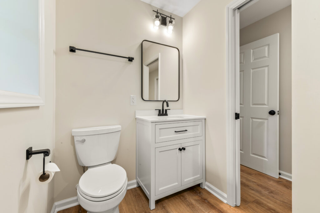 Toilet and vanity in a remodeled basement