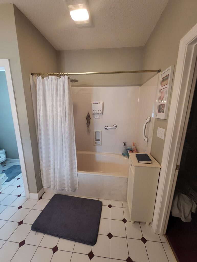 Outdated tub/shower before remodeling