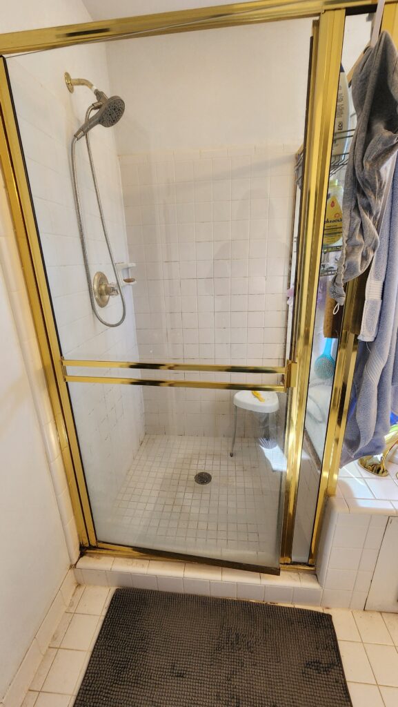Old shower with brass hardware
