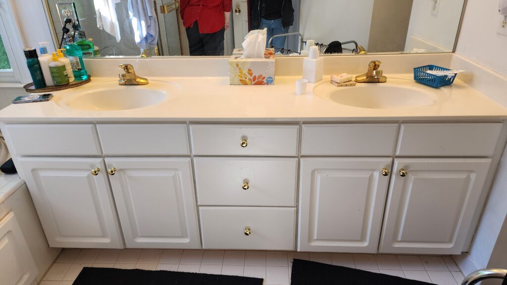 outdated vanity with raised panel doors