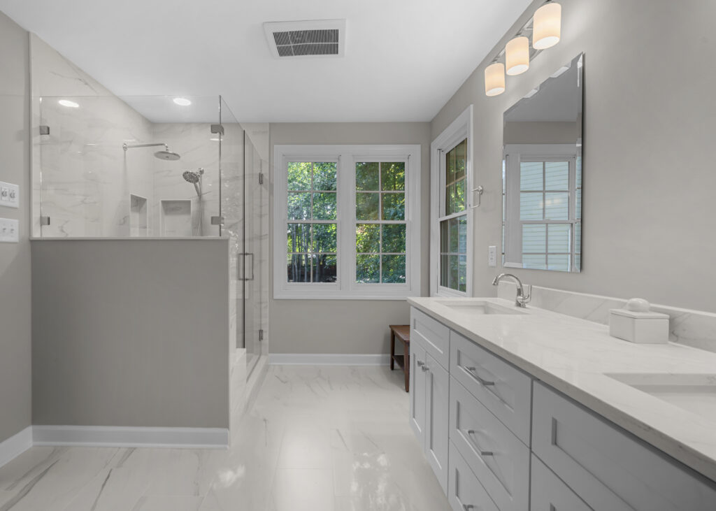 Renovated bathroom with vanity and shower in view