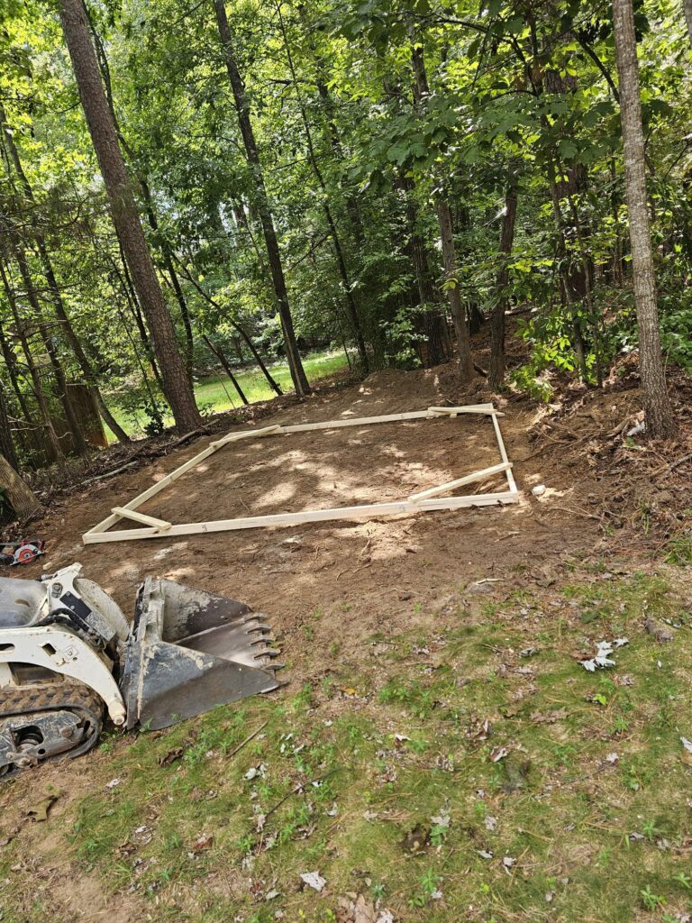 Exterior space with temporary frame on ground outlining where a detached building will be built