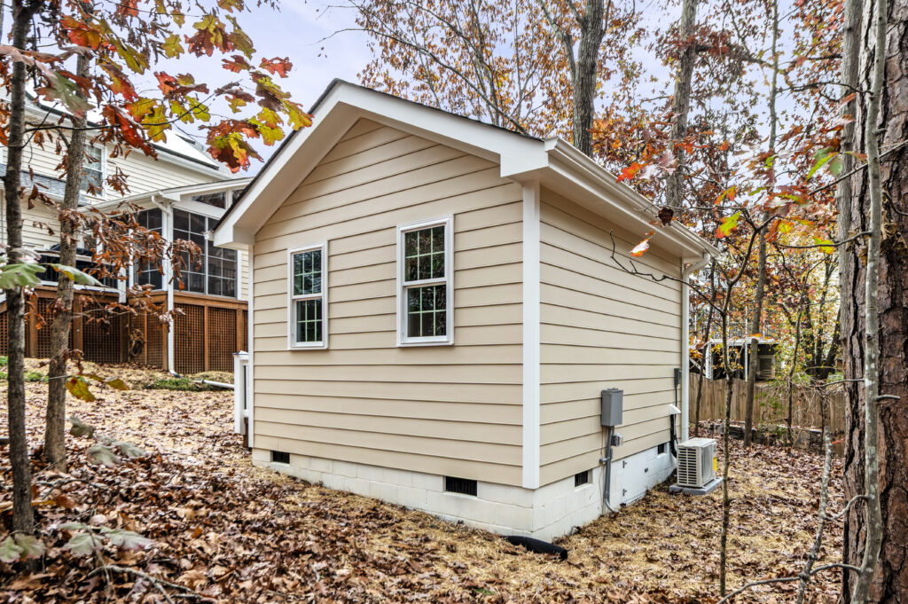 A side and rear view of a detached exterior building to be used as a home office