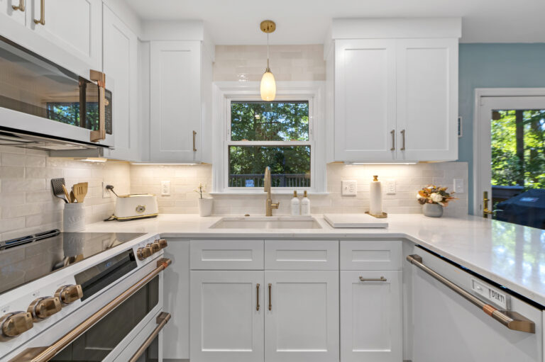Kitchen sink, stove and countertop after remodeling