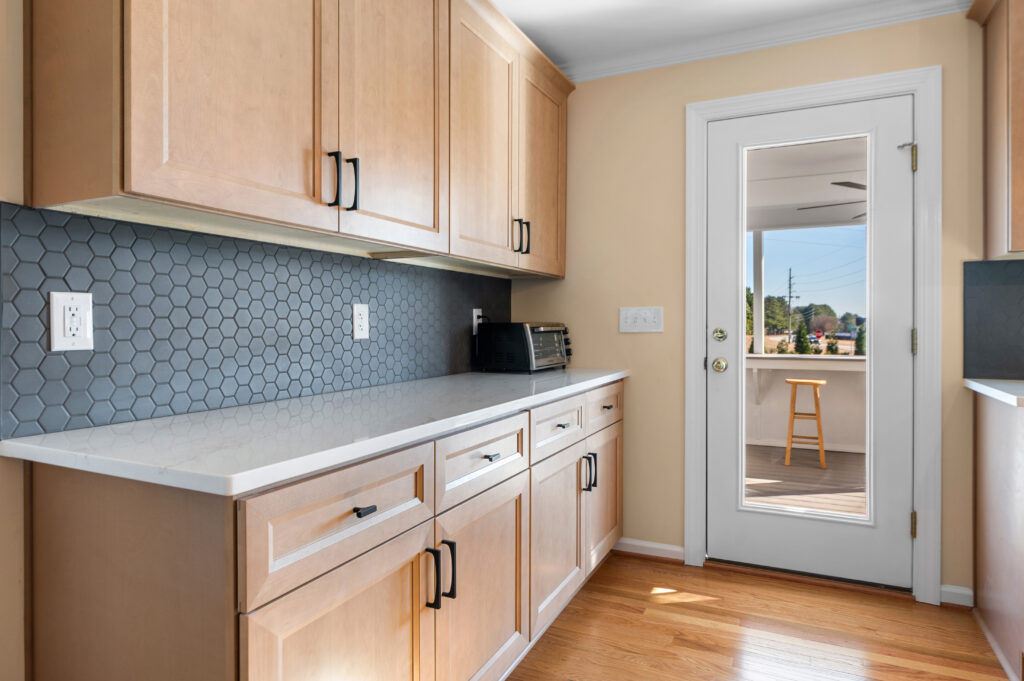 Added cabinets in a remodeled kitchen to improve lack of kitchen storage.