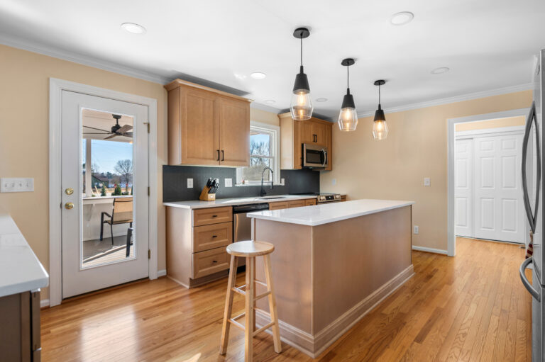 Kitchen after being remodeled with improved use of space, better flow and new finishes.