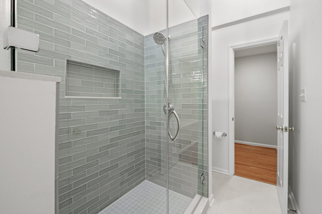 Renovated shower with blue tile
