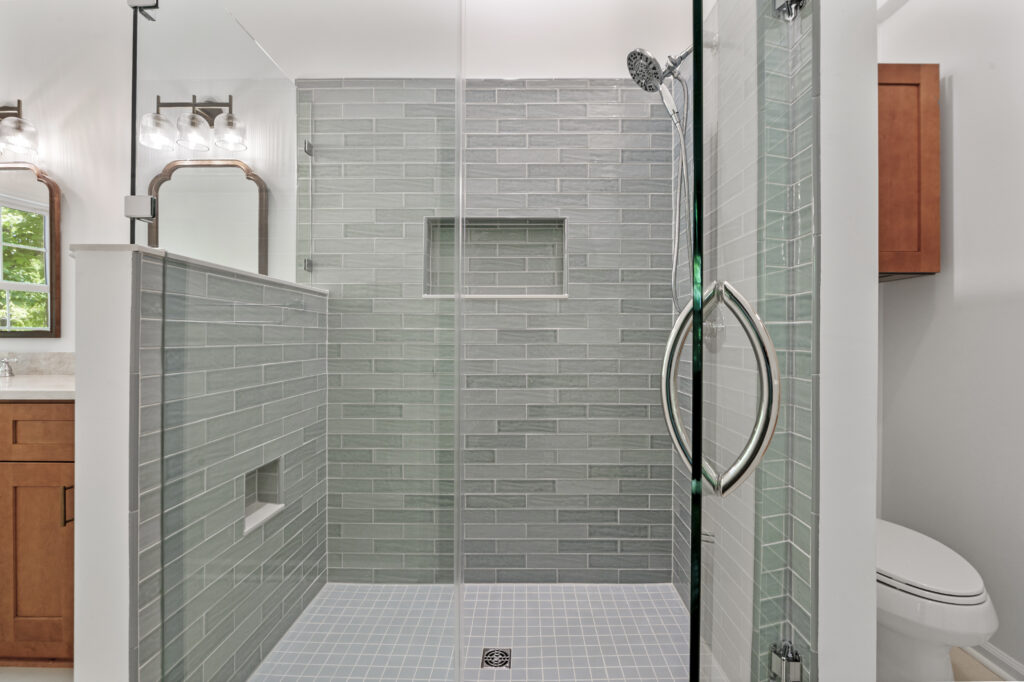Renovated shower with blue tile